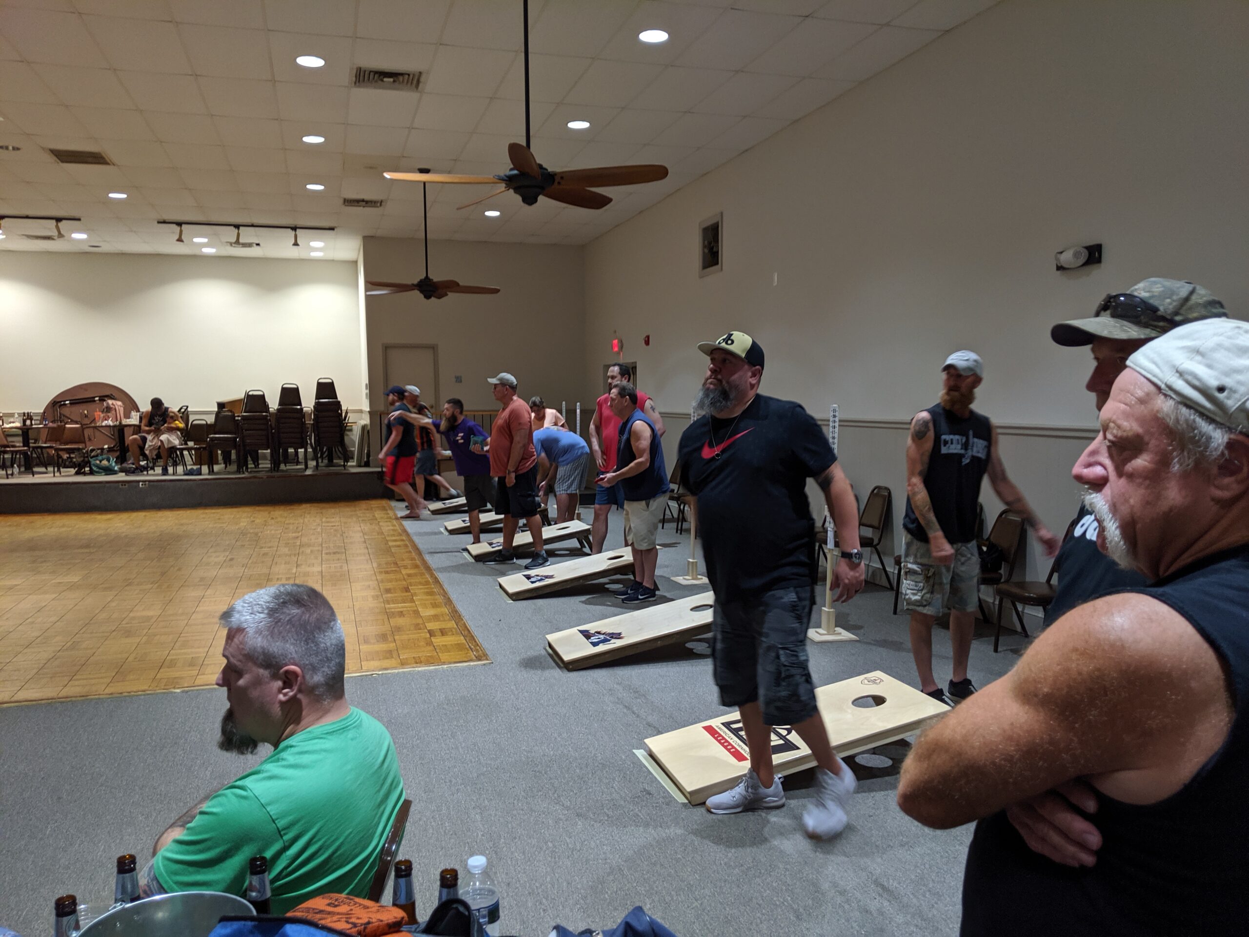 Graphic of men playing cornhole at the lodge